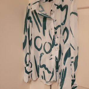 A green and creme blouse